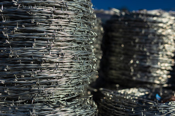 Barb wire in the sale yard of a farm and ranch store in rural Elizabeth, Colorado