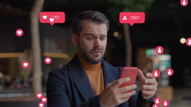 Serious sad young man in shopping mall hold uses smartphone typing social media icons with like comment follower counter quick decrease blogger influencer internet blog slow motion