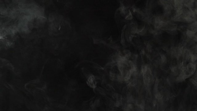 Realistic Smoke Clouds Fog flies through the frame. Good footage for effects and transitions. Smoke cloud on black isolated background