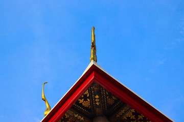 Roof style of Thai temple with gables with Naga-shaped features on the top