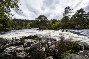 Picturesque landscape of a mountain river with traditional nature of Scotland.