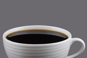 Black coffee in white cup isolated on gray background. Save with clipping path.