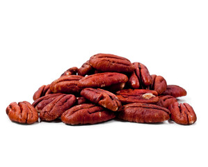 Peeled pecan nuts isolated on a white background.