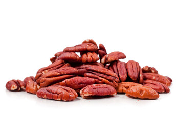 Peeled pecan nuts isolated on a white background.