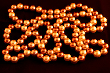 Pearl necklace close-up on a black background.