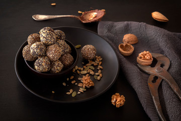 Healthy organic energy granola bites with nuts, cacao, banana and honey - sports food, vegetarian raw snack