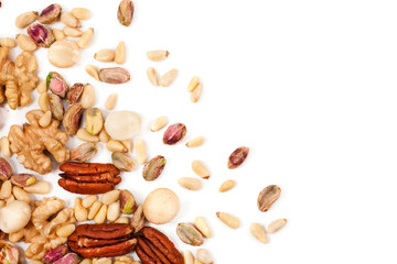 Background of different nuts. Pecan, macadamia, pistachio, pine nuts, walnuts isolated on a white background. Top view.