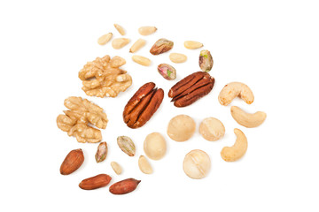Fototapeta na wymiar Background of different nuts. Pecan, cashew, macadamia, pistachio, pine nuts, walnuts isolated on a white background. Top view.