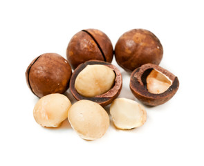 Macadamia nuts heap isolated on a white background.