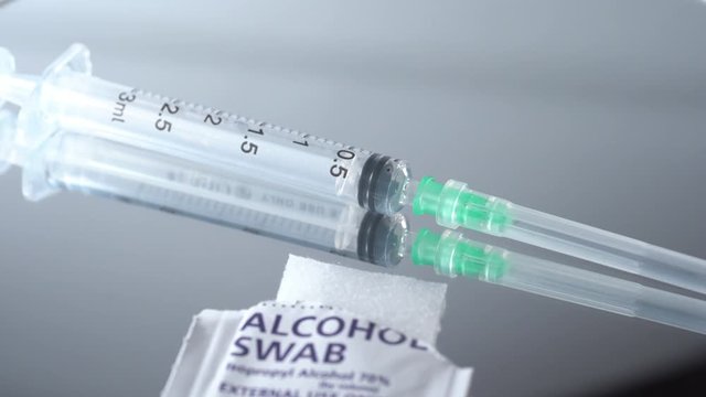 Closed up shot of an empty syringe with needle. used for blood taking and administered medications. Medical concept