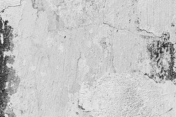 Texture of a concrete wall with cracks and scratches which can be used as a background