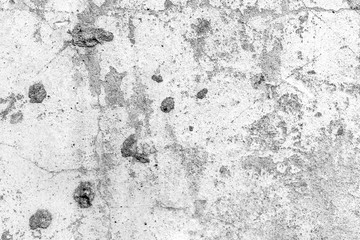 Texture of a concrete wall with cracks and scratches which can be used as a background