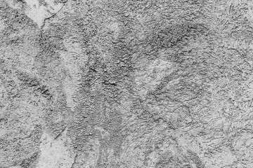 Texture of a concrete wall with cracks and scratches which can be used as a background