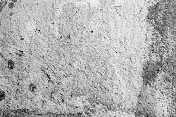 Texture of a concrete wall with cracks and scratches which can be used as a background
