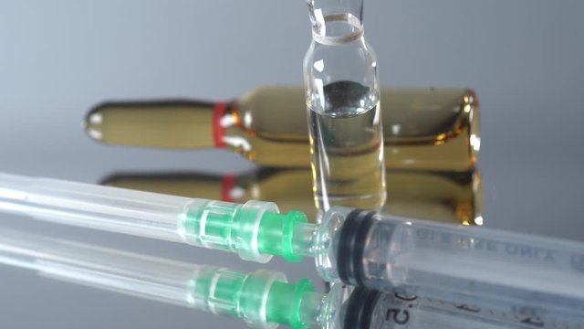 Closed up shot of an empty syringe with needle. used for blood taking and administered medications. Medical concept
