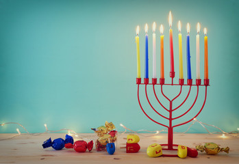 religion image of jewish holiday Hanukkah background with menorah (traditional candelabra) and spinning top