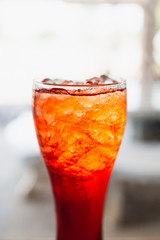 Lemon tea in clear glass Crop half a glass of bright colors