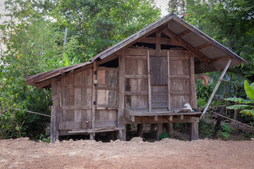 Wooden barn behind the country house of Thai farmer