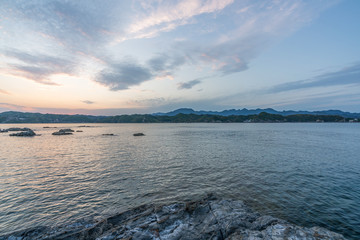 beautiful twilight sunset with blue sky high peak mountains mist fog green forest  park ocean sea idea for backpacker guiding backpacking camping campfire relax hiking  long weekend at Wakayama Japan