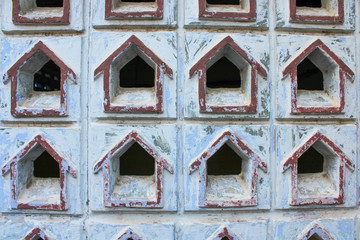 This is a picture of pattern of huts made on a wall.