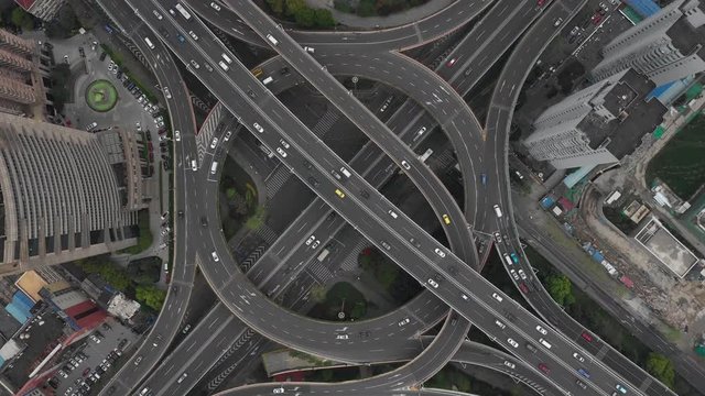 Aerial Video of car traffic and huge elevated road circle multilevel complex, car transportation scene in Shanghai, China in 4K UHD 