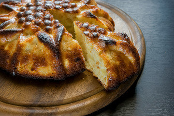 sliced homemade cake on wooden cutting board