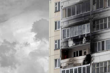 Modern apartment building with the consequences of a fire.