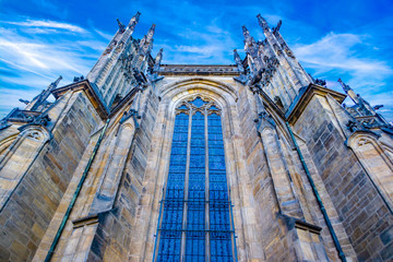 The impressive building of the old cathedral against the blue sky