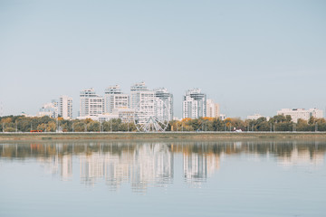  Silhouette of a modern city. Day panorama of Kazan and the river.