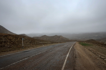 Fototapeta na wymiar Scenic misty mountain road in Dagestan view, Russia