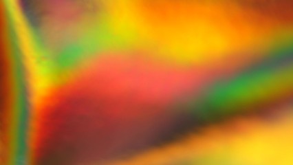 Holographic green, orange, yellow, gold gradient. Abstract background