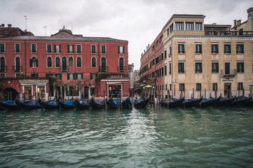 Fototapeta na wymiar Venice, Veneto, Italy - 15.11.2019, View of gondolas and typical Venetian houses and architecture. Beautiful and romantic Italian city on water. 