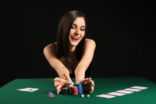 Female poker player at table in casino