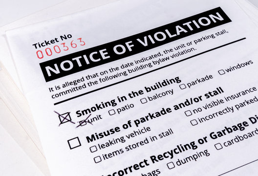 Notice Of Violation Ticket For Building Bylaws. Close Up. No Smoking In The Building Has A Check Mark. Strata Or Rental Property Management Tool To Warn About Smoking, Parking And Recycling. 