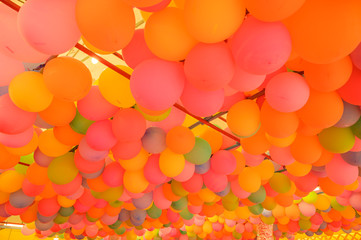Many balloons arranged in a lot.
