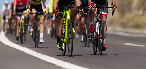 Naklejka na ściany i meble Cycling competition, cyclist athletes riding a race