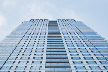 low angle view of glass office building.