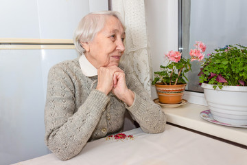 Portrait of smiling senior woman, looking at camera.