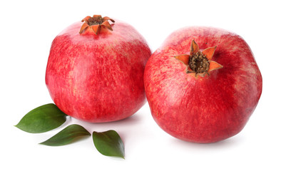 Ripe tasty pomegranates isolated on white