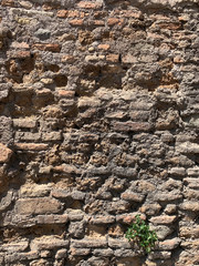 old antique stone ruined brown brick wall