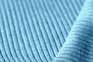 Knitwear texture close-up. Textile background blue color toned