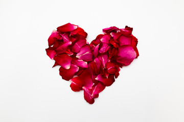 heart of rose petals isolated on white