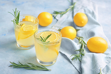 Glasses of fresh lemonade on table