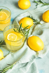 Glasses of fresh lemonade on table