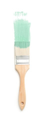 Brush with paint on light background