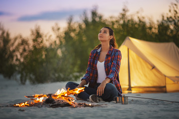 Tourist Woman in the Camp Near Campfire