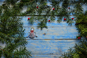 Christmas angel in composition on a blue background.