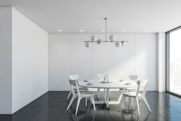 White dining room with round table