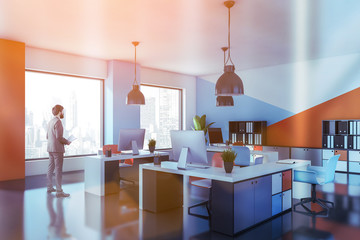 Man in orange and blue open space office