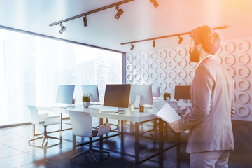 Businessman in white open space office